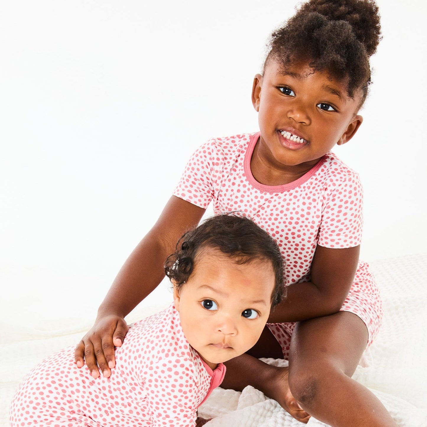 Soft & Stretchy Zipper Footie - Coral Dots