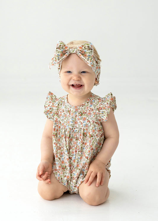SUNSET FIELDS FLORAL ROMPER