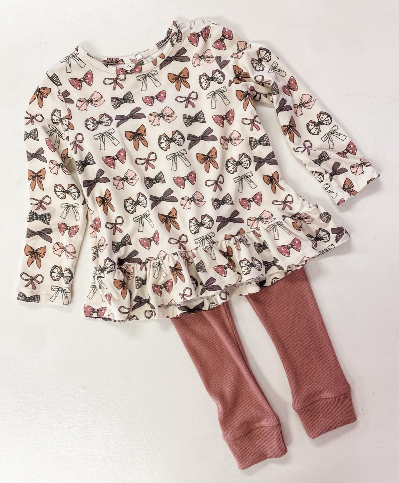 LONG SLEEVE PEPLUM TOP-BOWS