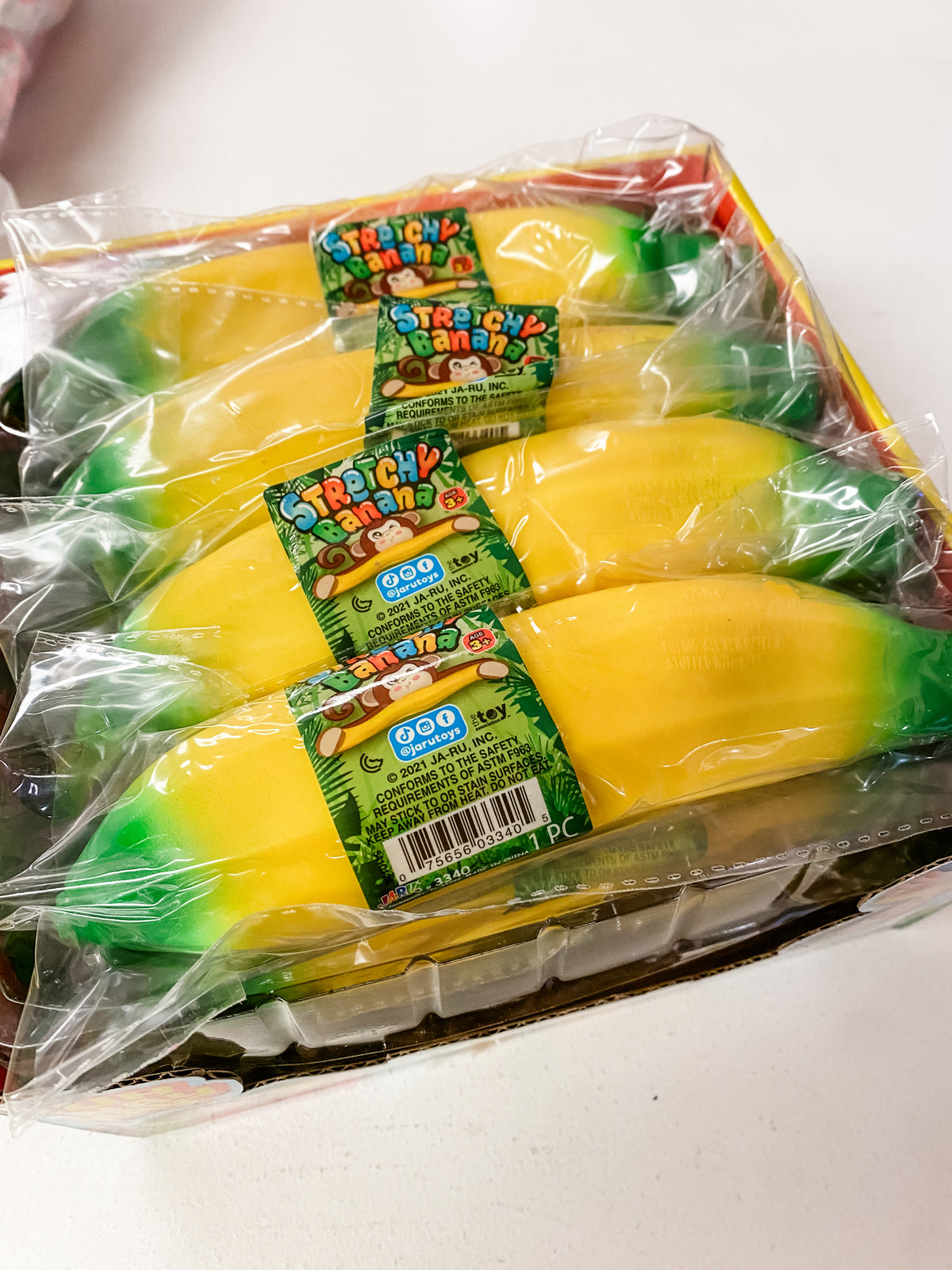 Squeesh Yum Buh Nay Nay Sand Filled Banana Squishy | Stretchy Sensory Toy
