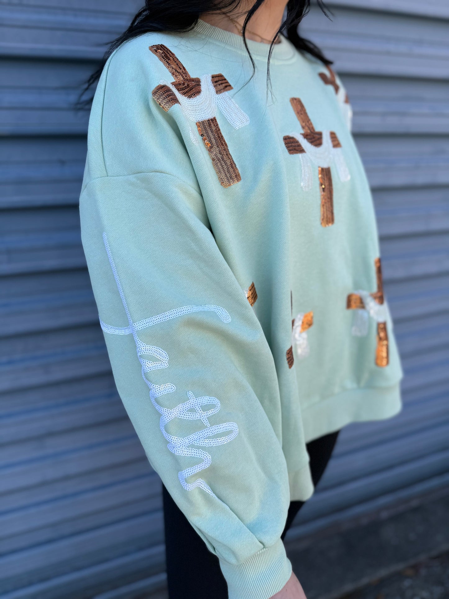 Victory over death cross sequin pullover