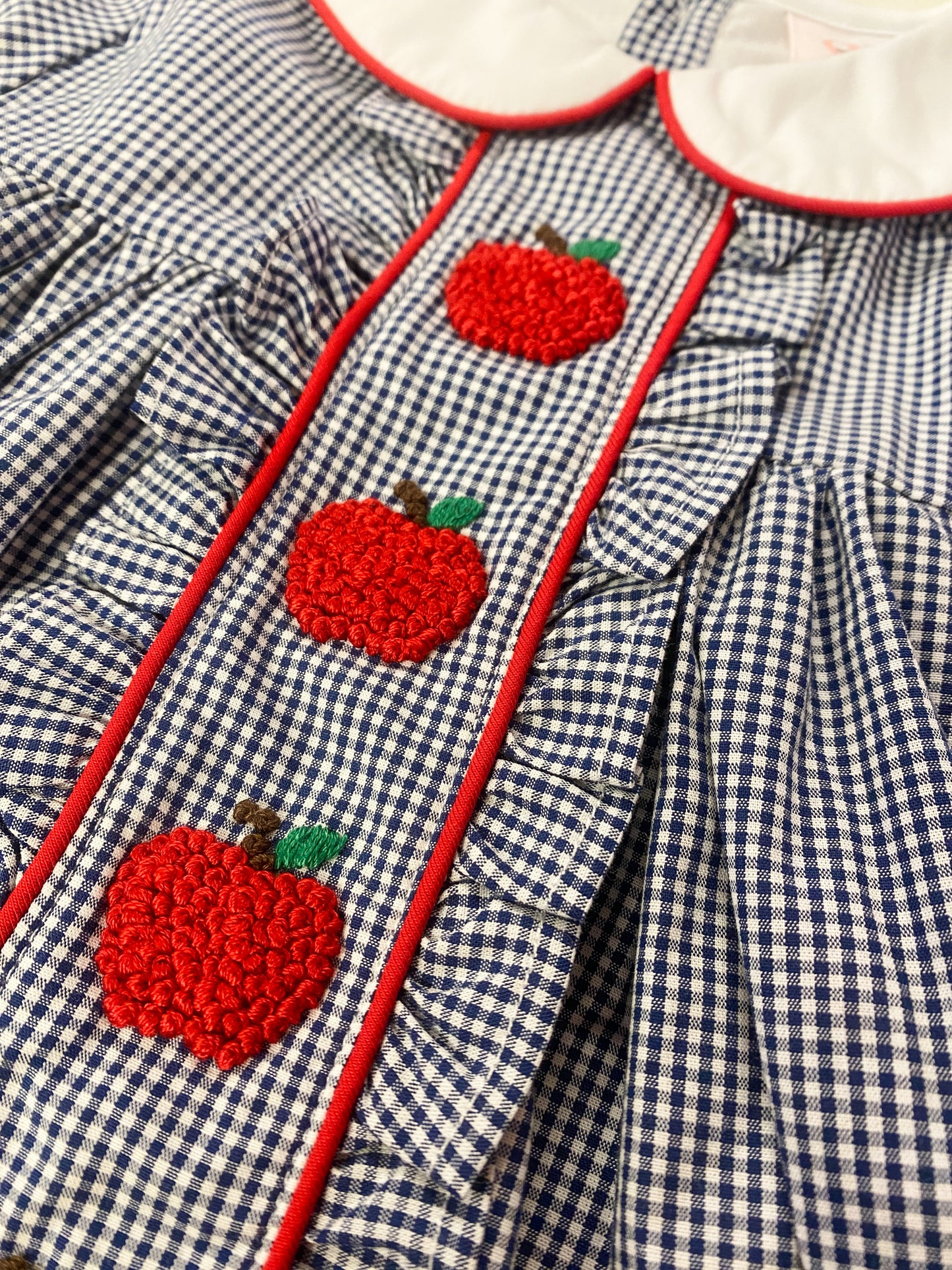 Girls Navy Apple Dress – Smocked Apple Back-to-School Dress with Peter Pan Collar | The Prissy Pelican Boutique Bossier City, LA