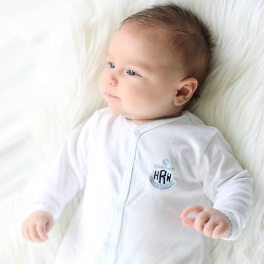 White with baby blue trim footie with anchor monogram