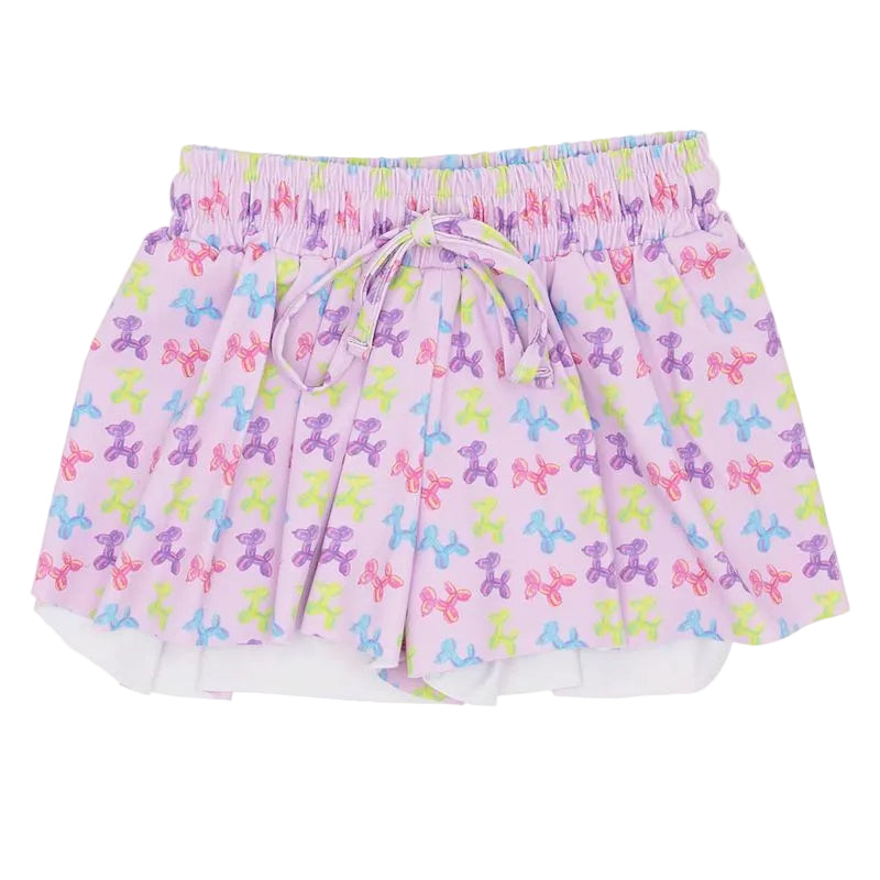 Skirt with colorful dog pattern on a white background, brand 'Agatha' visible.